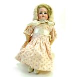 A 13” Kämmer & Reinhardt Dollyface Child doll. Markings "K star R 34 Halbig". Biscuit porcelain-