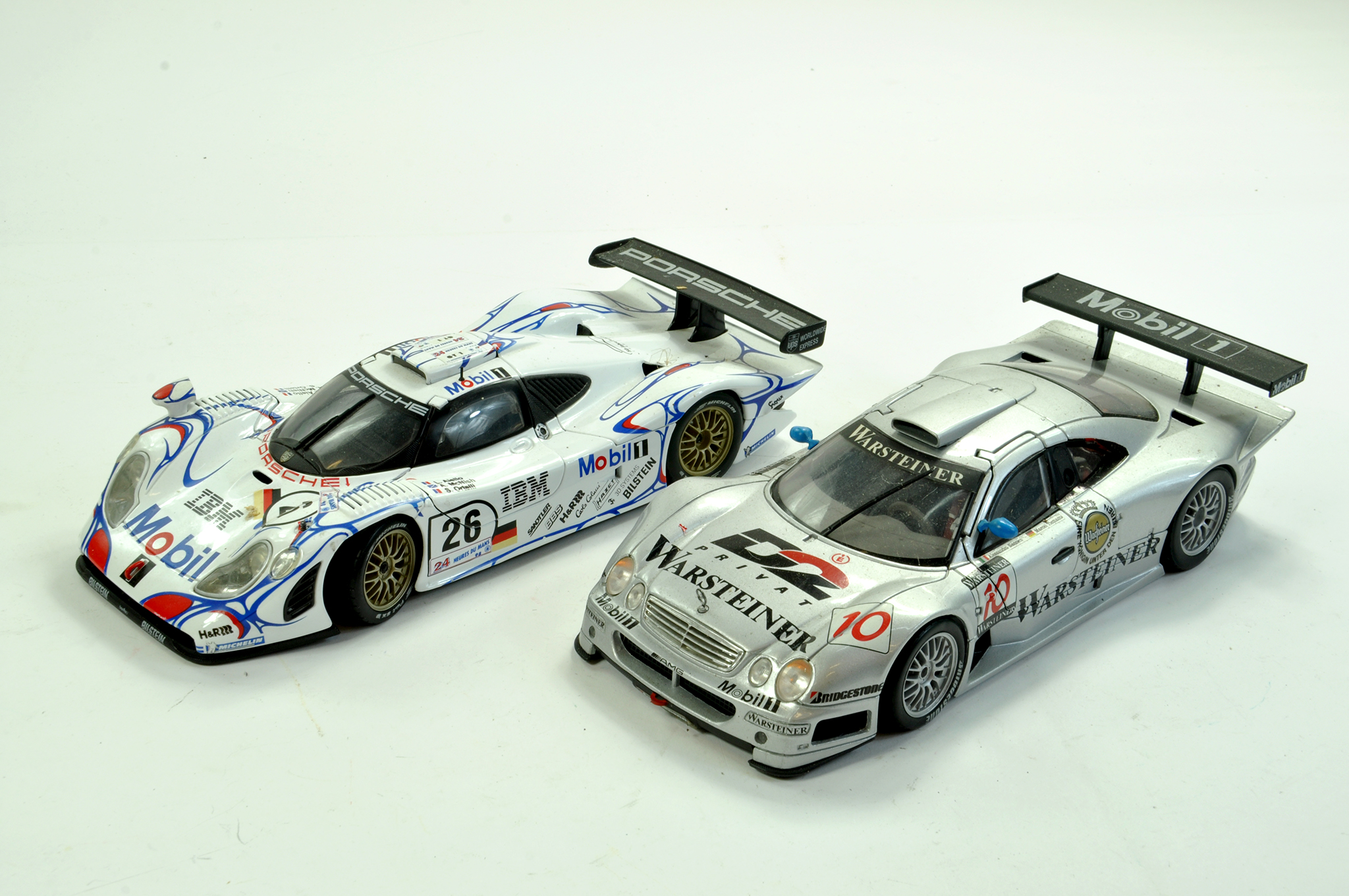 A duo of Maisto 1/18 diecast racing cars. Generally Good, albeit not checked for absolute