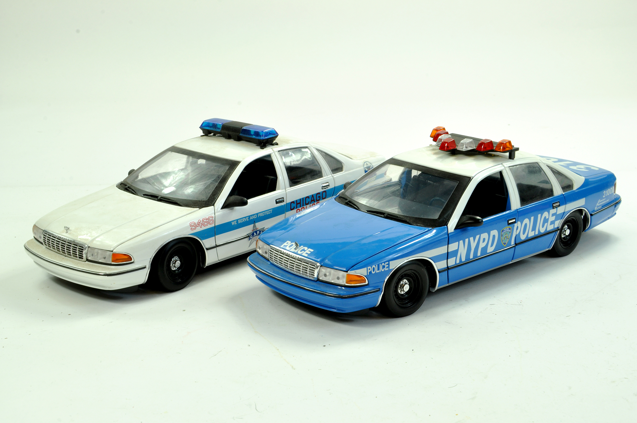UT Models 1/18 diecast American Police Patrol Cars x 2 comprising Chicago and NYPD issues. Generally