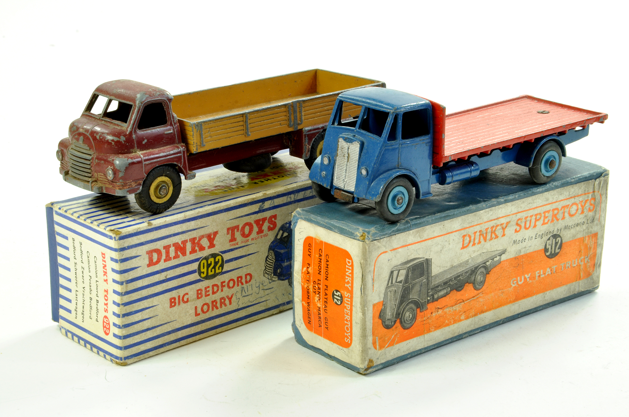 Dinky (worn) duo comprising No. 922 Bedford Lorry and No. 512 Guy Flat Truck. Fair to good in fair