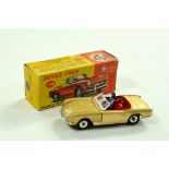 Dinky No. 114 Triumph Spitfire in metallic gold with red interior and driver figure. Chrome Spun
