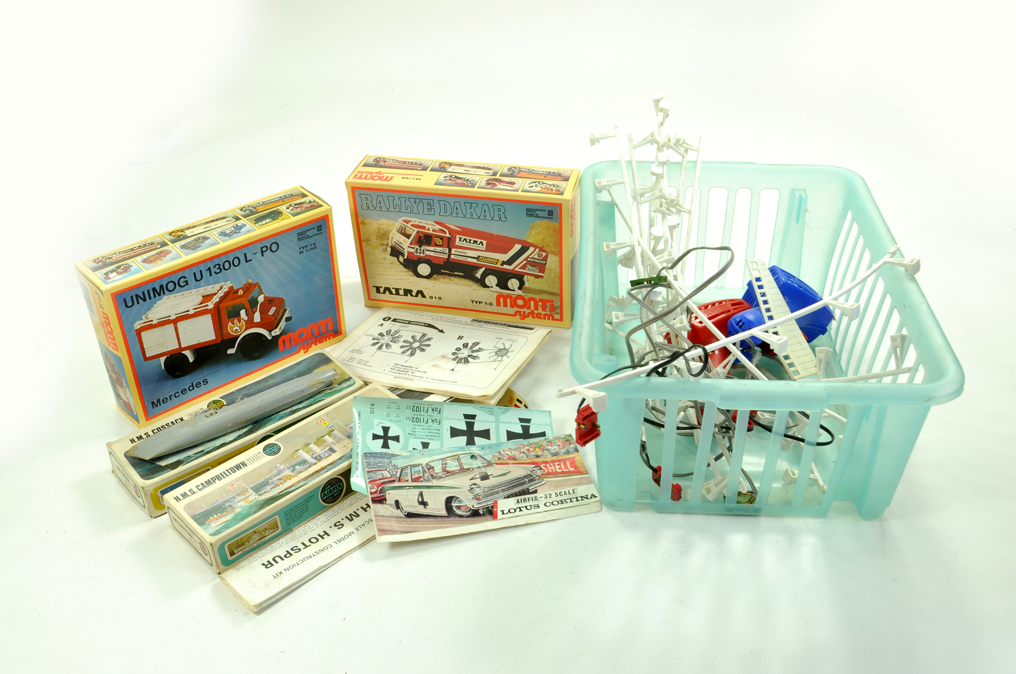 A misc toy group comprising duo of model kits, complete plus Airfix Lotus header card and other