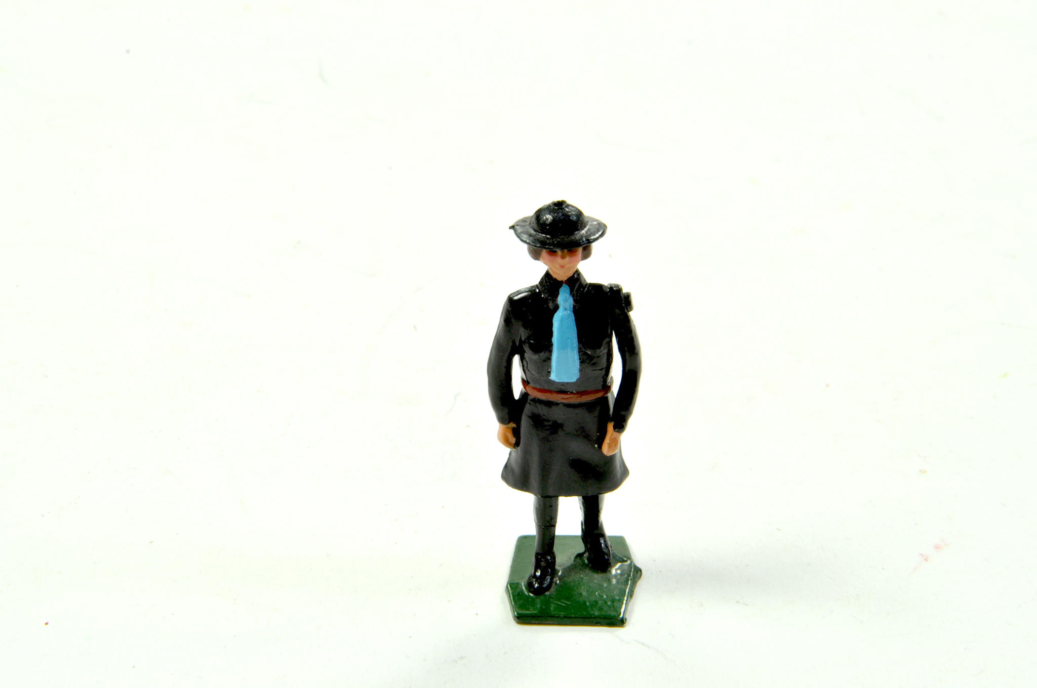 Metal Figure of Woman in Black, blue tie. Very Good to Excellent. Minor paint loss. Enhanced