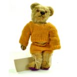 A well-loved vintage bear issue, some re-padding, no labelling or markings. Maintains a reasonable
