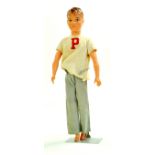 Vintage 1965 Pedigree 'Paul' Doll. He has brown, moulded hair and grey eyes. He is wearing an