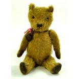 A rather tired vintage bear, plenty of love but now needs tlc. Likely British Made. Enhanced