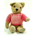 A well-loved vintage bear issue, no labelling or markings. Maintains a reasonable appearance with