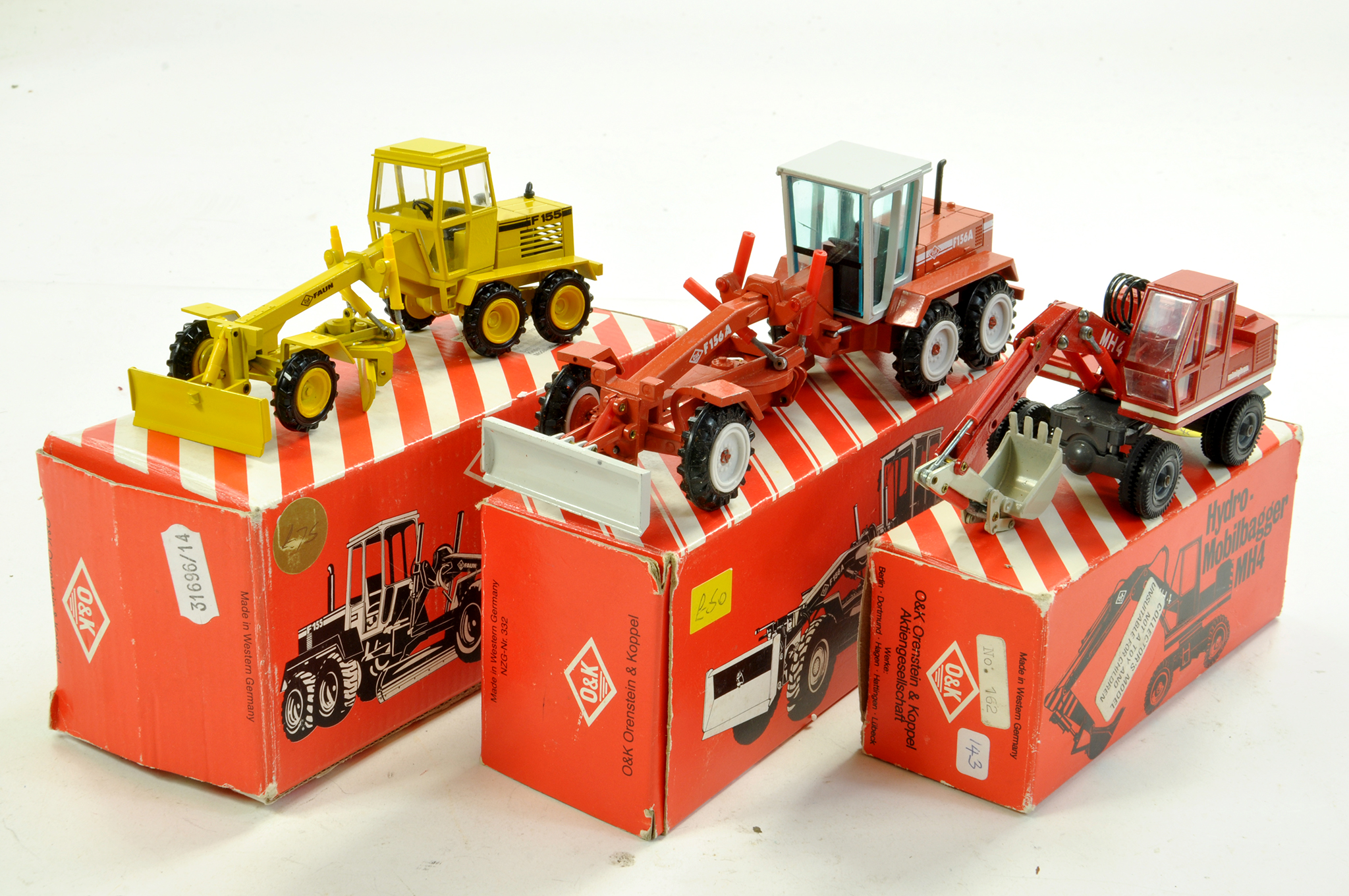 Conrad / NZG Diecast Construction Issues comprising O&K scraper duo plus wheel loader. Generally