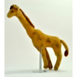 An unusual large vintage Giraffe, approx 45 cm tall in the style of Steiff. Generally good. Note: We