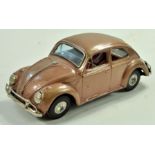 Bandai Tinplate Volkswagen Bettle in metallic brown. Fricton Driven. Appears generally very good,