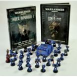 A group of Warhammer Figures including reference books. Appear good to very good. Note: We are