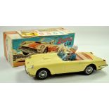 Bandi Battery Operated Tinplate Stunt Car. Toy is of Ferrai with Driver Figure in Lemon Yellow.