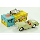 Corgi No. 305 Triumph TR3 Sports Car. Issue with green body, red seats, silver trim and flat spun