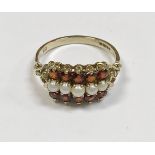 A 9ct gold mounted seed pearl and garnet ring size Q