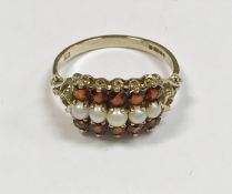 A 9ct gold mounted seed pearl and garnet ring size Q