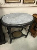 A 19th Century painted French two-tier oval table with marble top,