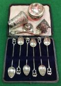 A set of six Indian white metal teaspoons with elephant finials, a Victorian evening cane handle,