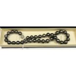 A South Sea (Northern Australian) black pearl necklace with silver clasp,
