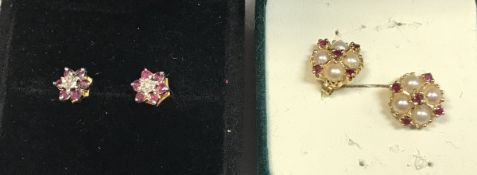 A pair of illusion set diamond and ruby ear studs and a pair of seed pearl and ruby ear studs