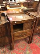 A George III mahogany night table the tray top above a tambour cupboard and converted drawer