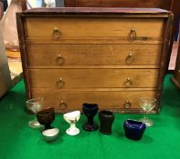 A Victorian pine four drawer collectors chest with chamfered front slide enclosing the four drawers