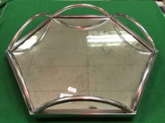 An Art Deco design lazy Susan or wedding cake stand of hexagonal form with mirrored base on a