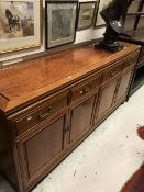 A Chinese hardwood sideboard the four drawers above four cupboard doors on bracket feet together