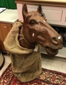 A modern cast iron horse head mount