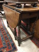 A 19th Century oak drop leaf gate leg table
