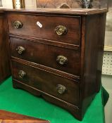 A 19th Century mahogany miniature square front chest of three drawers with embossed brass swan neck