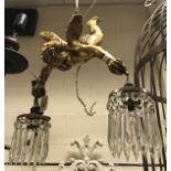 A gilded cherub hanging electrolier with glass lustre drops CONDITION REPORTS Light