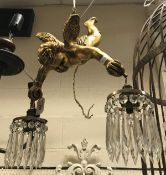 A gilded cherub hanging electrolier with glass lustre drops CONDITION REPORTS Light