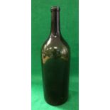 An early 19th Century green glass bottle