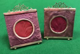 A pair of late Victorian silver mounted and purple silk embellished picture frames with scrollwork