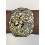 A white metal nurse's buckle with iris and butterfly decoration in the Art Nouveau manner