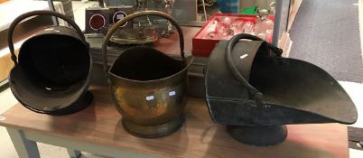 Two Victorian copper coal helmets and a beaten brass coal helmet