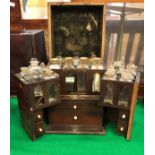 A 19th Century mahogany apothecary's cabinet with box wood stringing opening to reveal two fitted