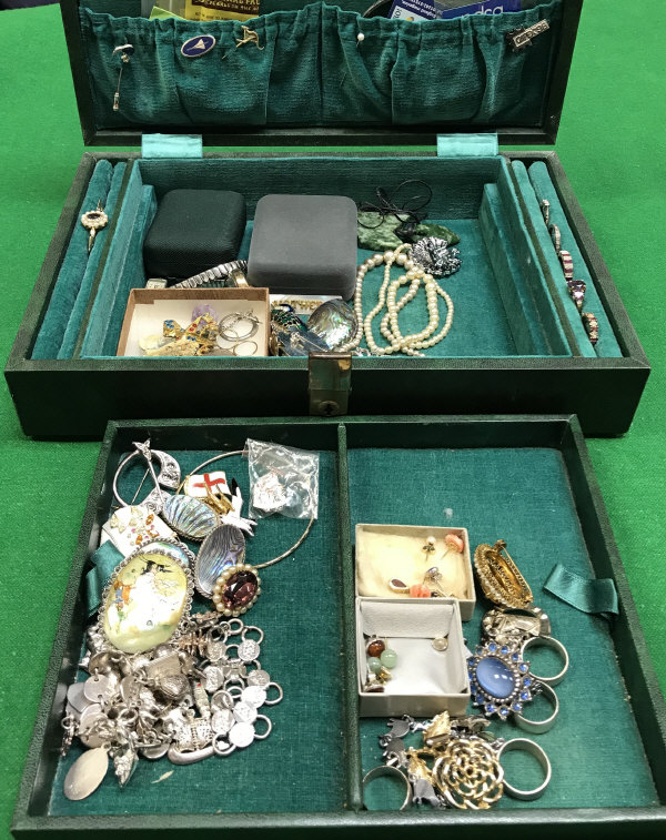 A collection of various costume jewellery including rings, badges, brooches, etc.