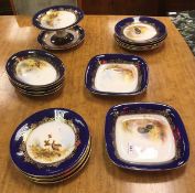 A collection of Royal Worcester game decorated dessert plates including circular plates and serving