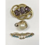 A Victorian pinchbeck and amethyst brooch,