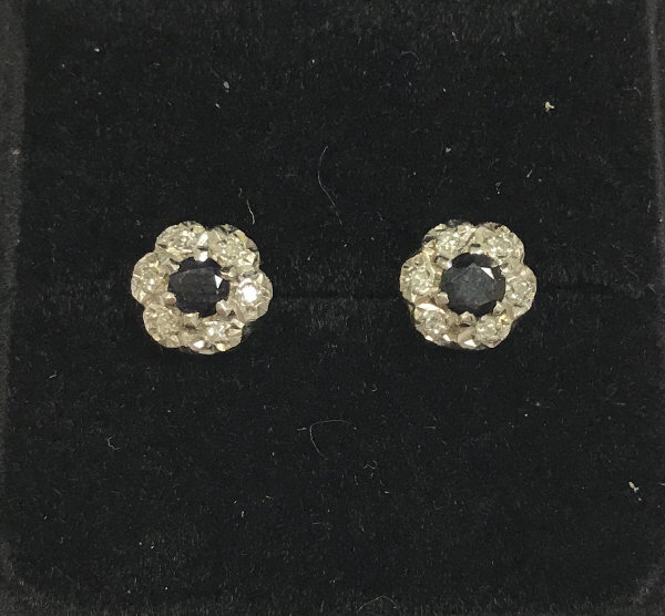 A pair of diamond and sapphire cluster ear studs