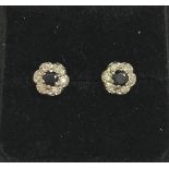 A pair of diamond and sapphire cluster ear studs