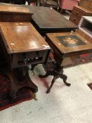 A Victorian walnut and marquetry inlaid worktable on carved quadruped base together with a