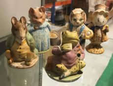 A collection of five Beswick Beatrix Potter figures including "Mr.