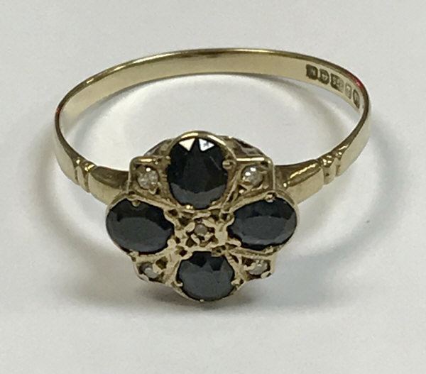 A 9 carat gold diamond and sapphire set ring, 1.