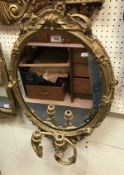 A 19th Century giltwood and gesso oval girandole mirror
