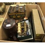 A box containing various objets du vertus including a toleware tea caddy,