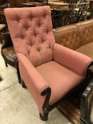 A Victorian show framed armchair with scroll arms and button back raised on ringed and turned front