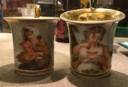 A pair of early 19th Century hand painted Sevres style cabinet cups decorated with "Two women"