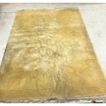 A Chinese superwash rug of plain yellow ground approx.